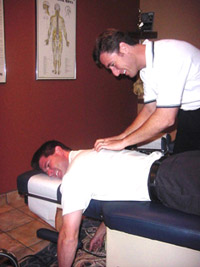 Dr. Levine gives a patient a chiropractic adjustment